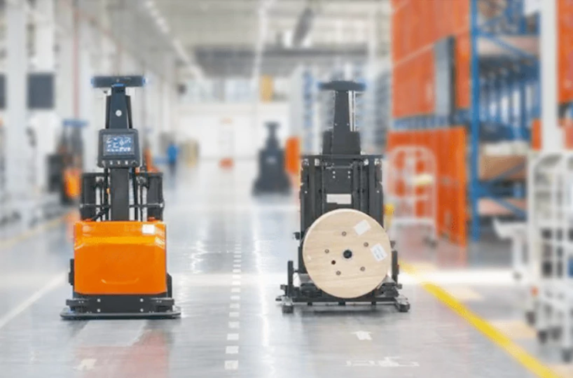 Unmanned forklift vehicle transporting cables in the workshop
